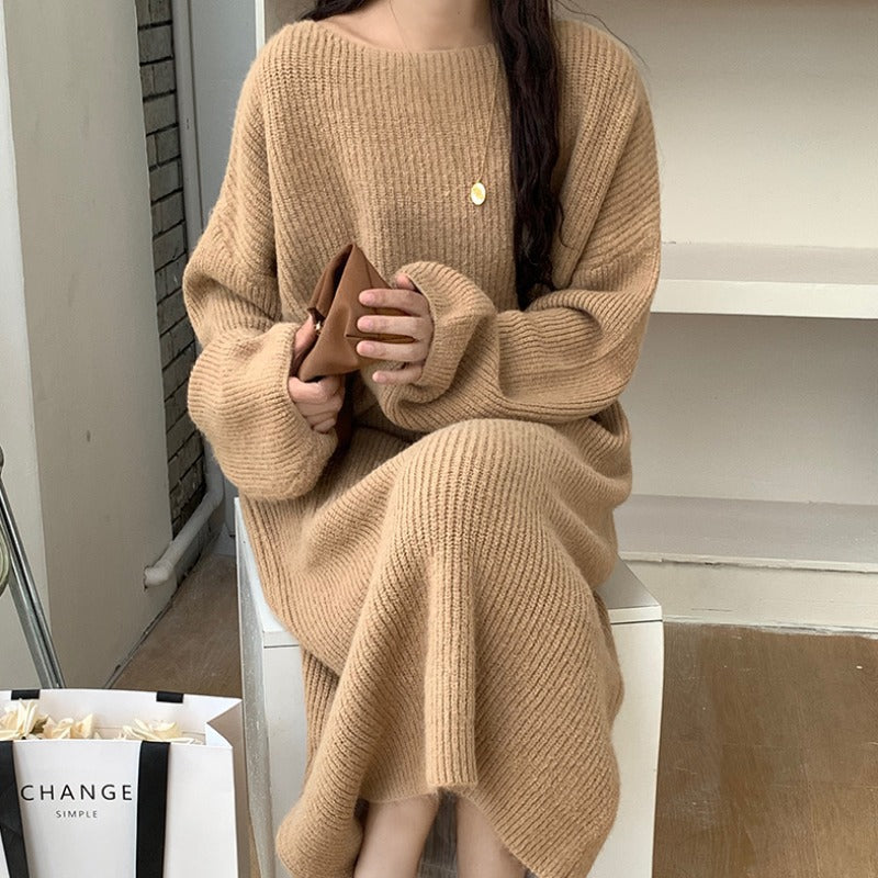 A Knee-length Knitted Sweater Dress Creates A Refined And Elegant Look For The Modern Woman